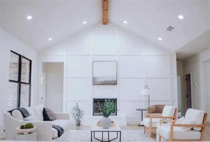 How do you style a living room with a vaulted ceiling?